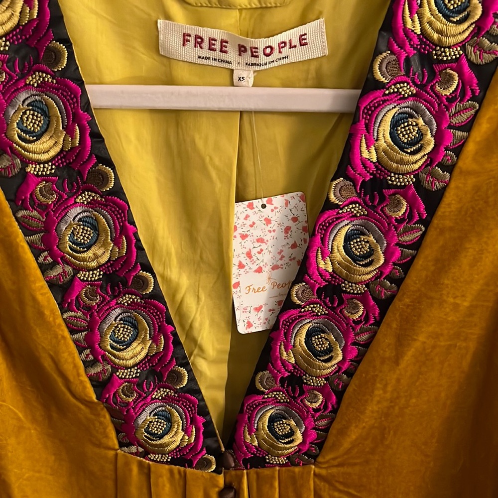 Beautiful Free people marigold jacket with lace detailing on sleeve.